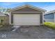 Two car detached garage featuring neutral paint, overhead lighting and a concrete floor with a driveway in front at 4125 Rookwood Ave, Indianapolis, IN 46208