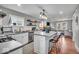 Modern kitchen featuring stainless steel appliances, white cabinets, and an island with seating at 4125 Rookwood Ave, Indianapolis, IN 46208