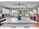 Well-lit kitchen featuring a large island, modern appliances, and ample counter space at 4125 Rookwood Ave, Indianapolis, IN 46208