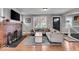 Cozy living room with a brick fireplace, comfortable seating, and ample natural light at 4125 Rookwood Ave, Indianapolis, IN 46208
