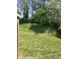 View of backyard landscaping showcasing the grassy hillside at 4211 Medina Way, Indianapolis, IN 46227