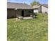Outdoor space with patio featuring a pergola and furniture, surrounded by a well-maintained lawn at 4211 Medina Way, Indianapolis, IN 46227
