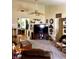 Bright living room with ceiling fan, wood trim, carpet and doorway leading to the rest of the home at 4211 Medina Way, Indianapolis, IN 46227