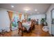 Elegant dining room with a large table, ornate chairs, and a sliding glass door to the outdoors at 4411 Rotterdam Dr, Indianapolis, IN 46228