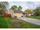 Modest single-story home featuring a one-car garage and a pleasant front lawn at 4411 Rotterdam Dr, Indianapolis, IN 46228