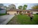 Cozy single-Gathering home with a neat front yard and attached one car garage at 4411 Rotterdam Dr, Indianapolis, IN 46228