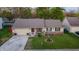 Charming single-story home with a well-maintained lawn and attached garage at 4411 Rotterdam Dr, Indianapolis, IN 46228
