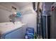 Practical laundry room with washer, dryer, shelving, and utility connections at 4411 Rotterdam Dr, Indianapolis, IN 46228