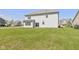 Spacious backyard with a large lawn, and a view of neighboring houses at 5635 Pennycress Dr, Noblesville, IN 46062