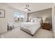 Neutral bedroom featuring a Queen bed, large window and side tables at 5635 Pennycress Dr, Noblesville, IN 46062
