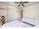 Bright bedroom featuring two twin beds, ceiling fan, and plenty of natural light at 5635 Pennycress Dr, Noblesville, IN 46062