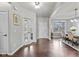 Bright foyer with hardwood floors, white trim, and views to the dining room at 5635 Pennycress Dr, Noblesville, IN 46062