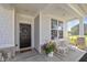 Inviting front porch featuring rocking chairs, flowers, and decorative door wreath at 5635 Pennycress Dr, Noblesville, IN 46062