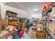 Cluttered garage with shelving and storage boxes at 5635 Pennycress Dr, Noblesville, IN 46062