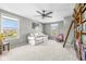 Cozy living room with a comfortable couch and large built in bookcase at 5635 Pennycress Dr, Noblesville, IN 46062