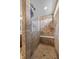 Walk in shower featuring neutral colored tiles with a built in bench at 5635 Pennycress Dr, Noblesville, IN 46062
