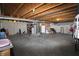Unfinished basement with exposed ductwork and various storage items at 5702 Saratoga Pl, Plainfield, IN 46168