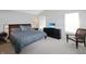 This is a primary bedroom with a decorative headboard and a large dresser with television at 5702 Saratoga Pl, Plainfield, IN 46168