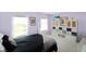 Bedroom featuring large bright windows, bed with black bedding, and wall decor at 5702 Saratoga Pl, Plainfield, IN 46168