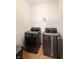 Laundry room with front loading washer and dryer and a wire storage shelf at 5702 Saratoga Pl, Plainfield, IN 46168