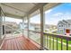 Balcony view overlooking neighborhood with wooden floors and white posts with railings at 5954 Crowley Pkwy, Whitestown, IN 46075