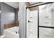 Features a tiled shower and soaking tub with tiled backsplash and a window at 5954 Crowley Pkwy, Whitestown, IN 46075
