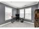 Bedroom area with a desk, chair, storage shelves, and windows letting in natural light at 5954 Crowley Pkwy, Whitestown, IN 46075