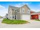 Side view of a two-story house with a two-car garage and ample driveway space at 5954 Crowley Pkwy, Whitestown, IN 46075