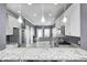 Bright kitchen with white cabinets, stainless steel appliances and granite countertops, and modern pendant lighting at 5954 Crowley Pkwy, Whitestown, IN 46075