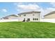 A well-manicured lawn and patio create an inviting outdoor space for relaxation and entertaining in the backyard at 6040 Juniper Ct, Whitestown, IN 46075