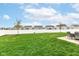 Expansive backyard featuring lush green grass, framed by a white fence for privacy and outdoor enjoyment at 6040 Juniper Ct, Whitestown, IN 46075