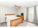 This is a beautiful bedroom with a ceiling fan, a window, and light colored walls at 6040 Juniper Ct, Whitestown, IN 46075