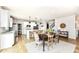 Modern kitchen featuring a central island with bar seating, stainless steel appliances, and a cozy dining area at 6040 Juniper Ct, Whitestown, IN 46075