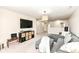 Spacious living room featuring a sectional sofa, media console, and open layout at 6040 Juniper Ct, Whitestown, IN 46075