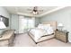 Serene main bedroom with a tray ceiling, large window, and neutral decor at 6040 Juniper Ct, Whitestown, IN 46075