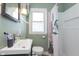 Cozy bathroom featuring a sleek sink, toilet, shower/tub, and tasteful decor at 6180 Crittenden Ave, Indianapolis, IN 46220