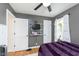 Comfortable bedroom with hardwood floors, ceiling fan, and plenty of storage at 6180 Crittenden Ave, Indianapolis, IN 46220