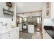 Open kitchen with stainless steel appliances flows into a cozy living space at 6180 Crittenden Ave, Indianapolis, IN 46220