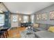 Inviting living room with hardwood floors, stylish decor, and an abundance of natural light at 6180 Crittenden Ave, Indianapolis, IN 46220