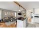 Open-concept living area featuring hardwood floors, stylish furnishings, and a seamless flow between rooms at 6180 Crittenden Ave, Indianapolis, IN 46220