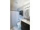 Clean bathroom featuring a shower with curtain, a vanity, and a mirrored cabinet for storage at 6315 Shelbyville Rd, Indianapolis, IN 46237