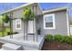 Charming front porch featuring stylish plants, and gray painted floors at 6315 Shelbyville Rd, Indianapolis, IN 46237