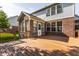 Large deck, brick sunroom and fenced-in backyard ideal for outdoor entertaining at 6527 Briarwood Pl, Zionsville, IN 46077