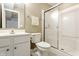 Bathroom featuring a sink, toilet, and glass-enclosed shower with white trim at 6527 Briarwood Pl, Zionsville, IN 46077