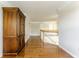 Upstairs hallway featuring hardwood floors and a view of the staircase at 6527 Briarwood Pl, Zionsville, IN 46077