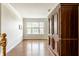 Hallway with hardwood floors leading to other rooms in the house at 6527 Briarwood Pl, Zionsville, IN 46077