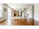 Open-concept kitchen with an island and tiled flooring flowing into a sunlit breakfast area at 6527 Briarwood Pl, Zionsville, IN 46077