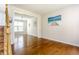 Bright living room with hardwood floors and modern lighting at 6527 Briarwood Pl, Zionsville, IN 46077