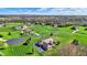 Expansive aerial view of homes on large lots with green grass and mature trees at 6829 Whitetail Woods Ct, Bargersville, IN 46106