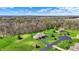Lush greenery surrounds the beautiful home with long driveway and mature trees at 6829 Whitetail Woods Ct, Bargersville, IN 46106